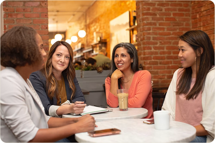 Women meeting at a cafe table